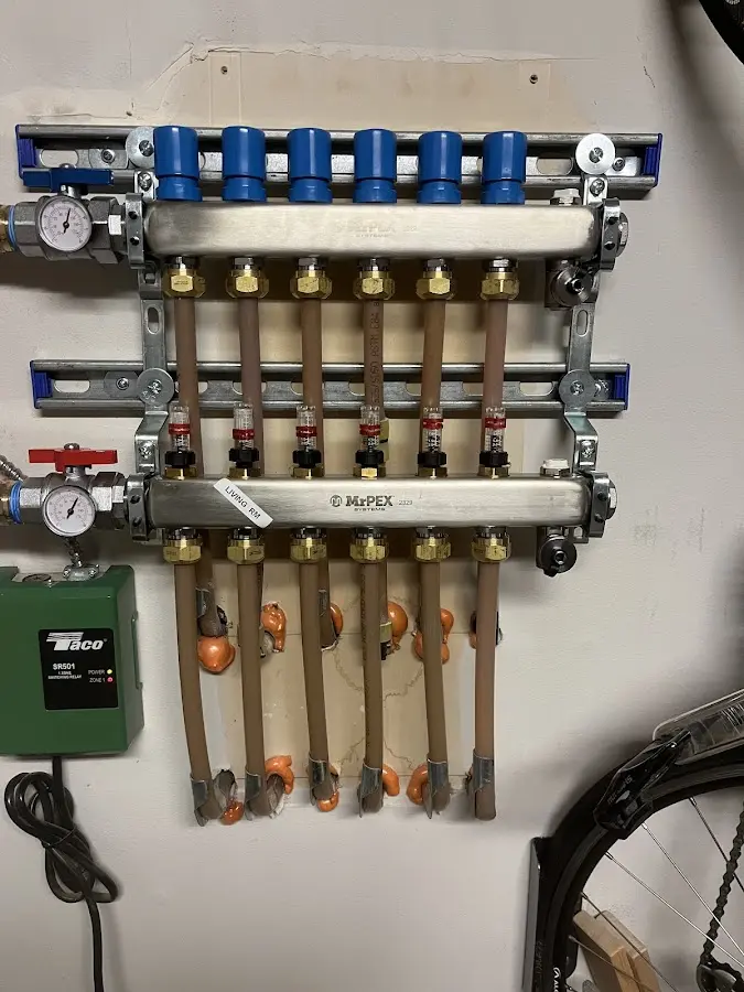 Plumber performing Gas Line Installation at a residential property in Littleton